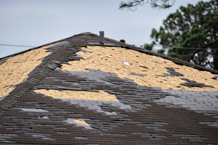 Broken shingles on roof